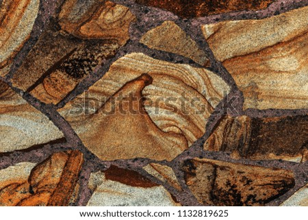 Texture of ancient stone wall.  beautiful stone background pattern  color modern style design decorative uneven cracks real surface of stone wall with cement