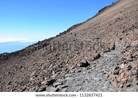Path  with rocks and blue sky on top of El Teide volcano Tenerife
