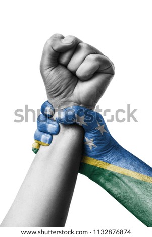 Fist painted in colors of Solomon islands flag, fist flag, country of Solomon islands
