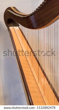 Celtic irish harp, classical and traditional string music instrument, detail.