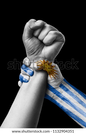 Fist painted in colors of Uruguay flag, fist flag, country of Uruguay