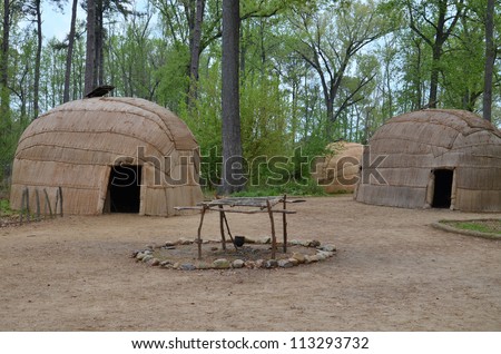 wigwam type thatch huts in native american camp site