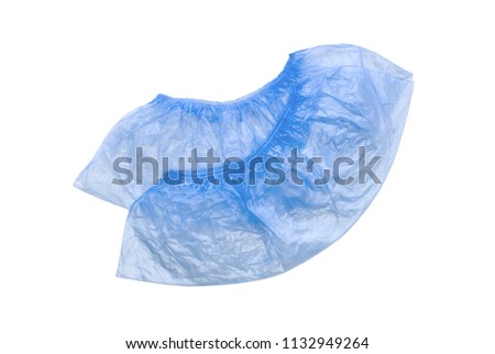 Two medical blue shoe covers overshoes isolated on white background. Catalog top view Royalty-Free Stock Photo #1132949264