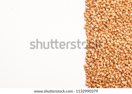 Raw buckwheat on white background