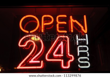 neon shining signboard with word "open" night