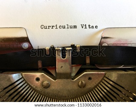 Curriculum Vitae, title headline typewritten on white paper on vintage manual typewriter machine