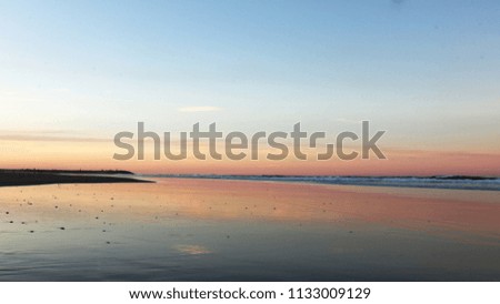 dusk scene at beach with land