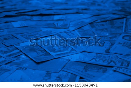 Blue colored money of different countries. Coins and banknotes. Currencies