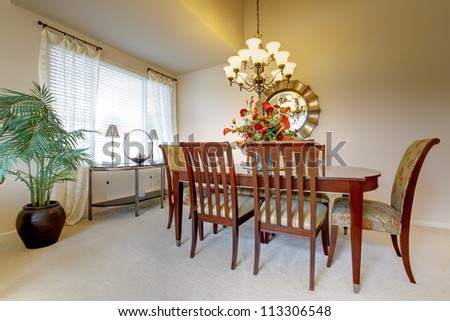 Golden dining room with elegant classic furniture.