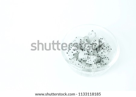 Dragon Fruit diced in a glass bowl on white background