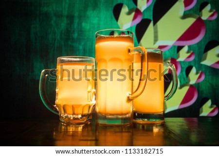 Beer glasses on table. Support your country with beer concept. Selective focus