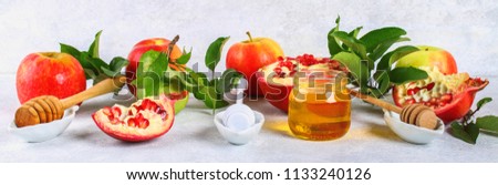 Rosh hashanah jewish New Year holiday concept. Traditional symbol. Apples, honey, pomegranate. Royalty-Free Stock Photo #1133240126