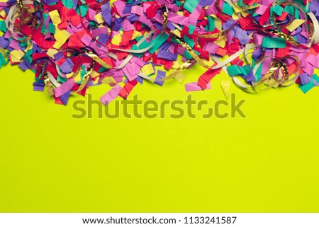 festive party decor and confetti on colored background