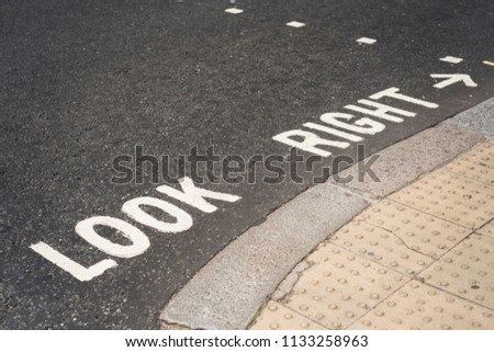 Look right written on pavement in London