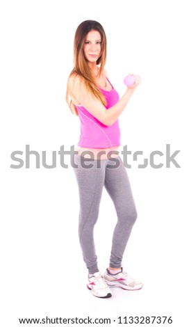 Young active woman doing exercise with dumbbells against a white background