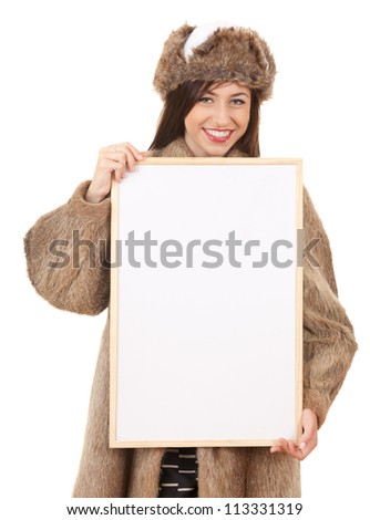 teenage girl in fur clothes with blank board, white background