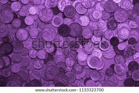 Purple money of different countries. Coins and banknotes. Currencies