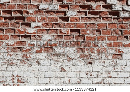 Old red-white brick wall as background, texture