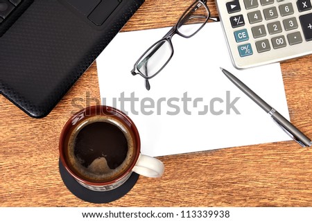 coffee, laptop, glasses,  pen and  blank paper