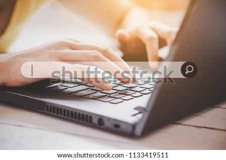 woman hand searching browsing internet data on computer notebook  