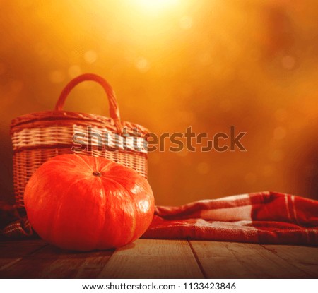 Table background of orange color and autumn time. Free space for your decoration. 