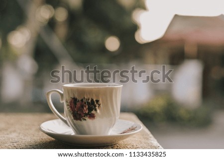 a cup of coffee on the wall