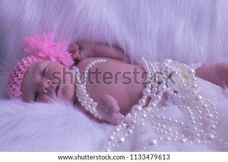 Newborn pictures of female baby
