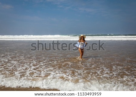 Girl on the beach in swimsuit. The Atlantic Ocean Agadir Morocco.