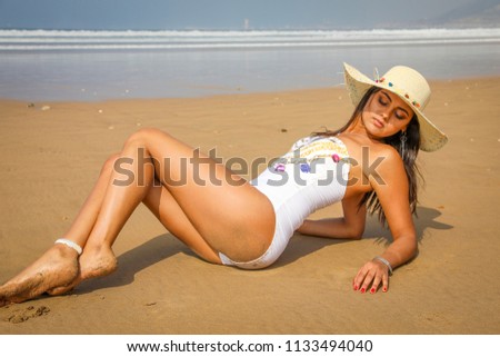 Girl on the beach in swimsuit. The Atlantic Ocean Agadir Morocco.