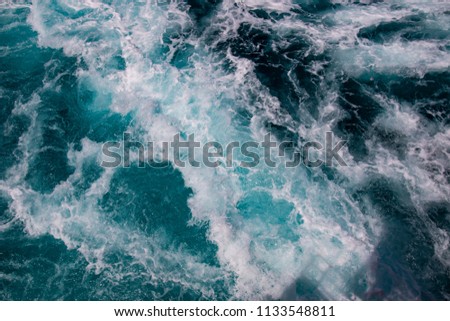 Ocean surface, sea foam on blue ocean, Ship trace, background