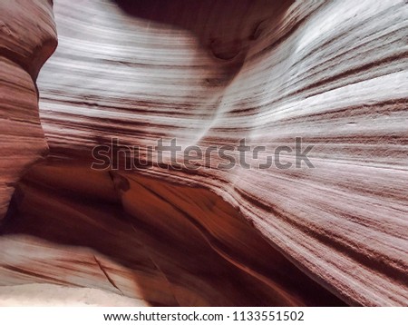 Upper Antelope Canyon. A slot canyon in the American Southwest. It is on Navajo land east of Page, Arizona. A narrow canyon, formed by the wear of water rushing through rock. 