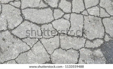 Close up of road crack texture after rain