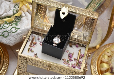 A watch of gold in a black box. Wedding Watch
