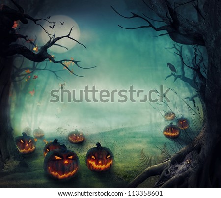 Halloween design - Forest pumpkins. Horror background with autumn valley with woods, spooky tree, pumpkins and spider web. Space for your Halloween holiday text. Royalty-Free Stock Photo #113358601