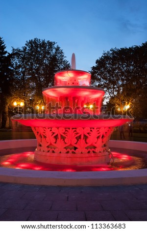 Red illuminated fountain in the park, Moscow, Russia