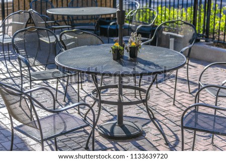 Metal table and chairs outside of shop