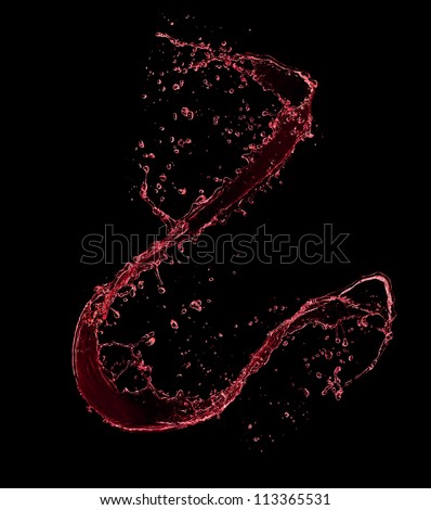 Red wine splash, isolated on black background