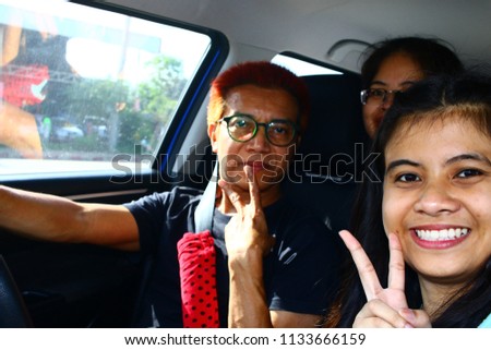 Happy family photography selphie at the car in THAILAND.