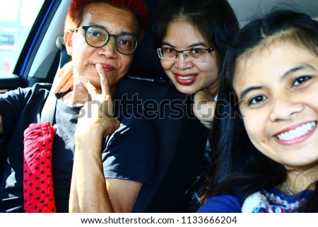Happy family photography selphie at the car in THAILAND.