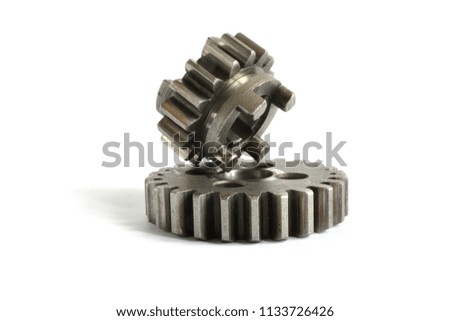 Two metal gears on the white background.
