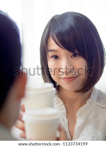 young asian couple taking tea time 