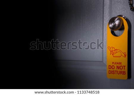 private room ,Closed door of hotel room with please do not disturb sign
