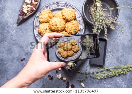 Woman make photo shoot on mobile phone camera, food blogger conc