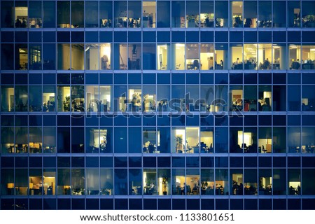 People work in the office building in the financial city center. Royalty-Free Stock Photo #1133801651