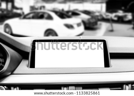 Monitor in car with isolated blank screen use for navigation maps and GPS. Isolated on white with clipping path. Car detailing. Modern car interior details. Black and white