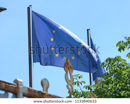 Close-up of the flags of the European Union and France.
