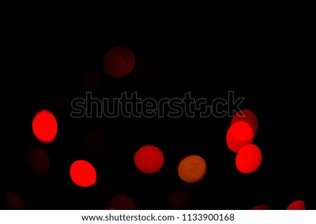 Lights red color on black background. Abstract lights red. Red bokeh effect.