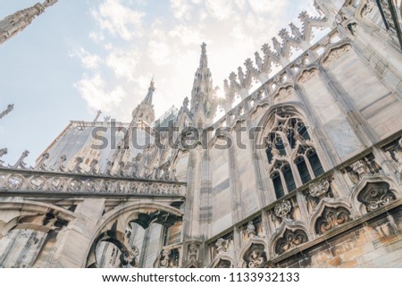 View for sun light with detail of the roof of Milan Cathedral (Duomo di Milano) in Milan, Italy.