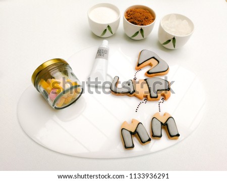 a serving plate of cute 3D puzzle elephant cookies with Chocolate-hazelnut paste, Marshmallow and topping suger rock,brown suger,white suger,  