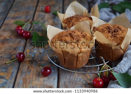 Muffin from flax seeds, millet and rice flour with cherries. Homemade baking. Organic healthy vegetarian food. Gluten free. Dairy free. Grain free pastries. Rustic photo. Copy space